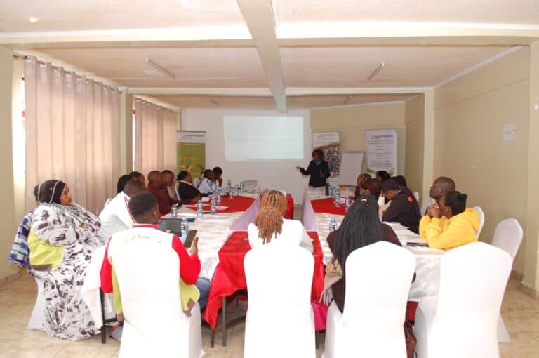 Volunteers running a training session with young people